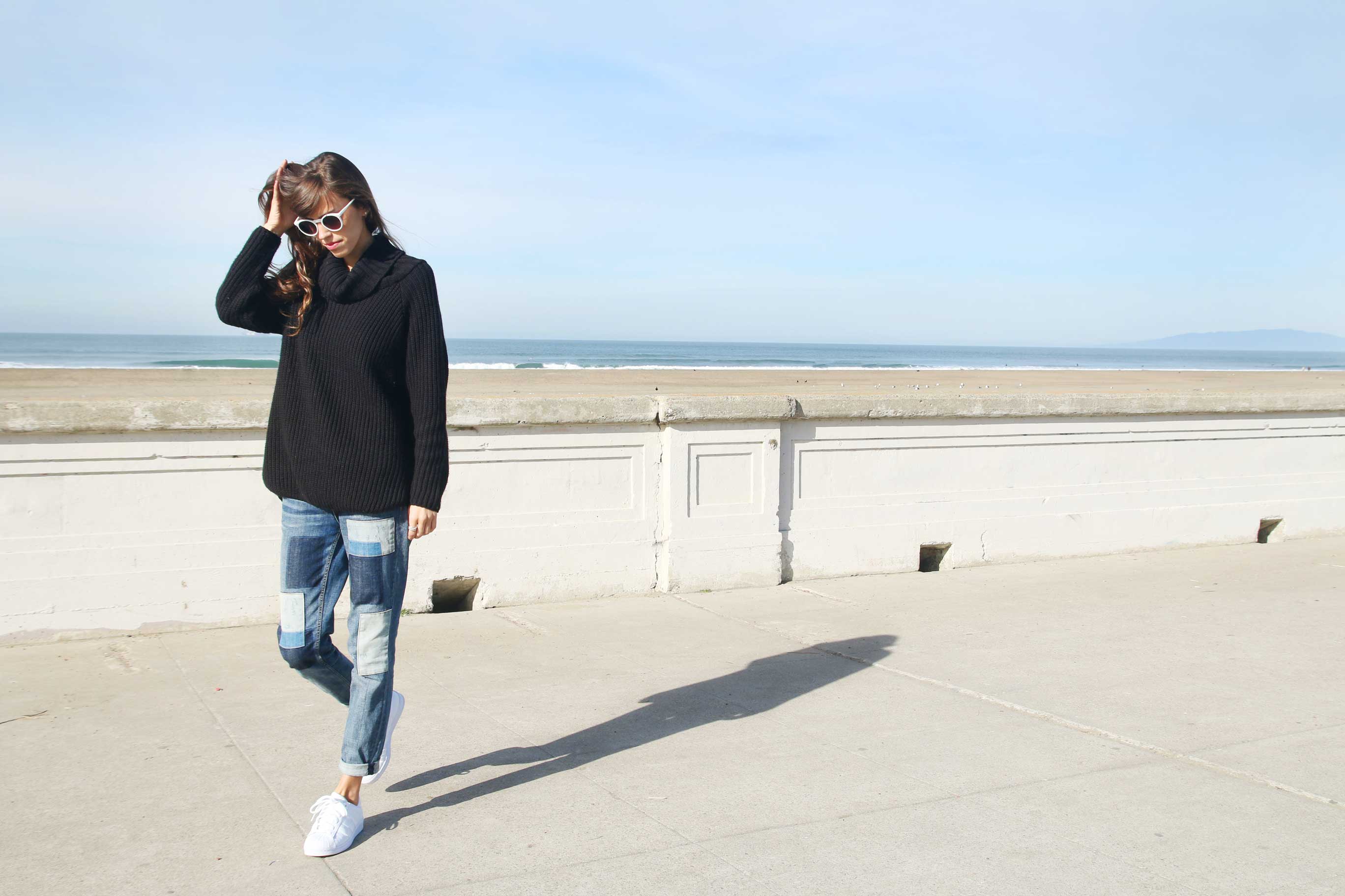 kendall at beach in turtleneck, jeans and adidas